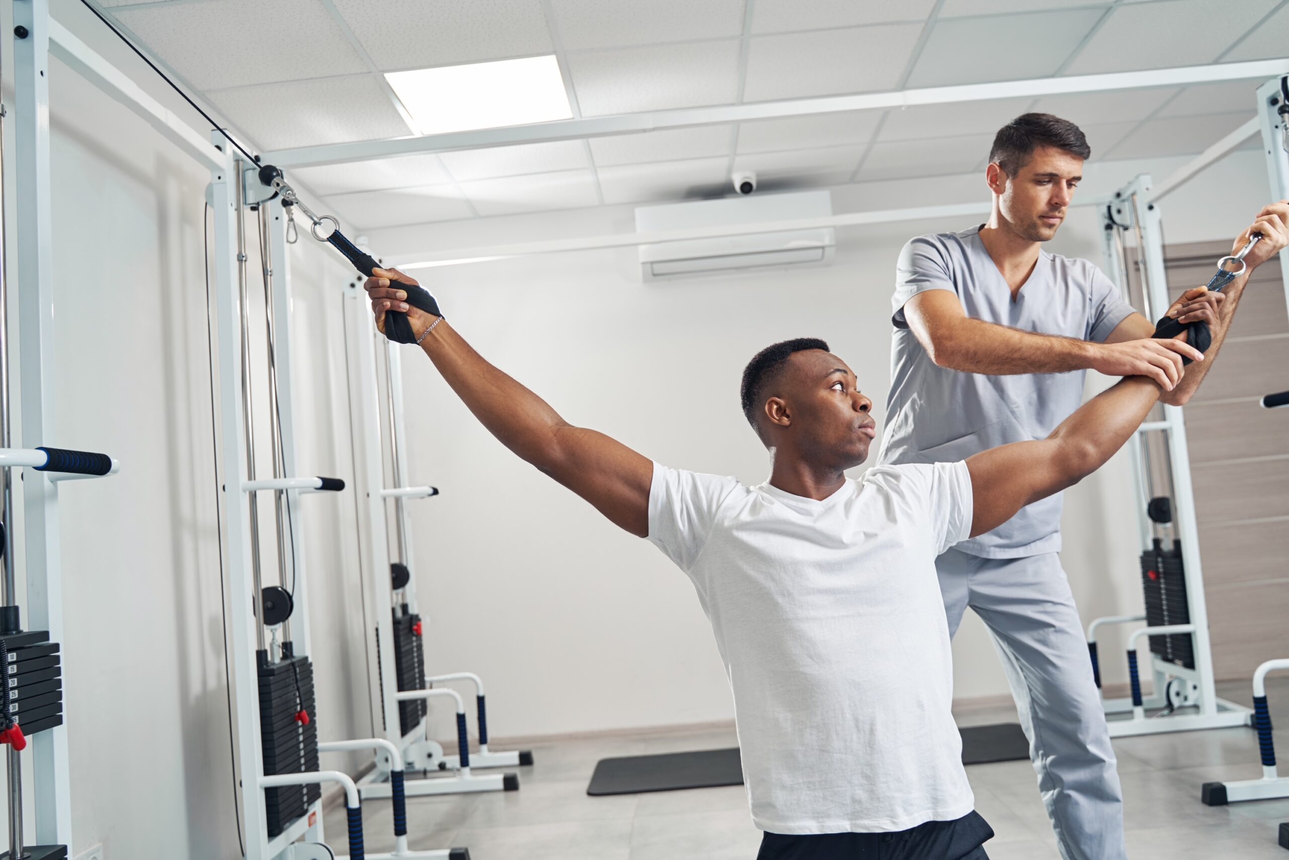 Man undergoing physiotherapy session with professional physiotherapist