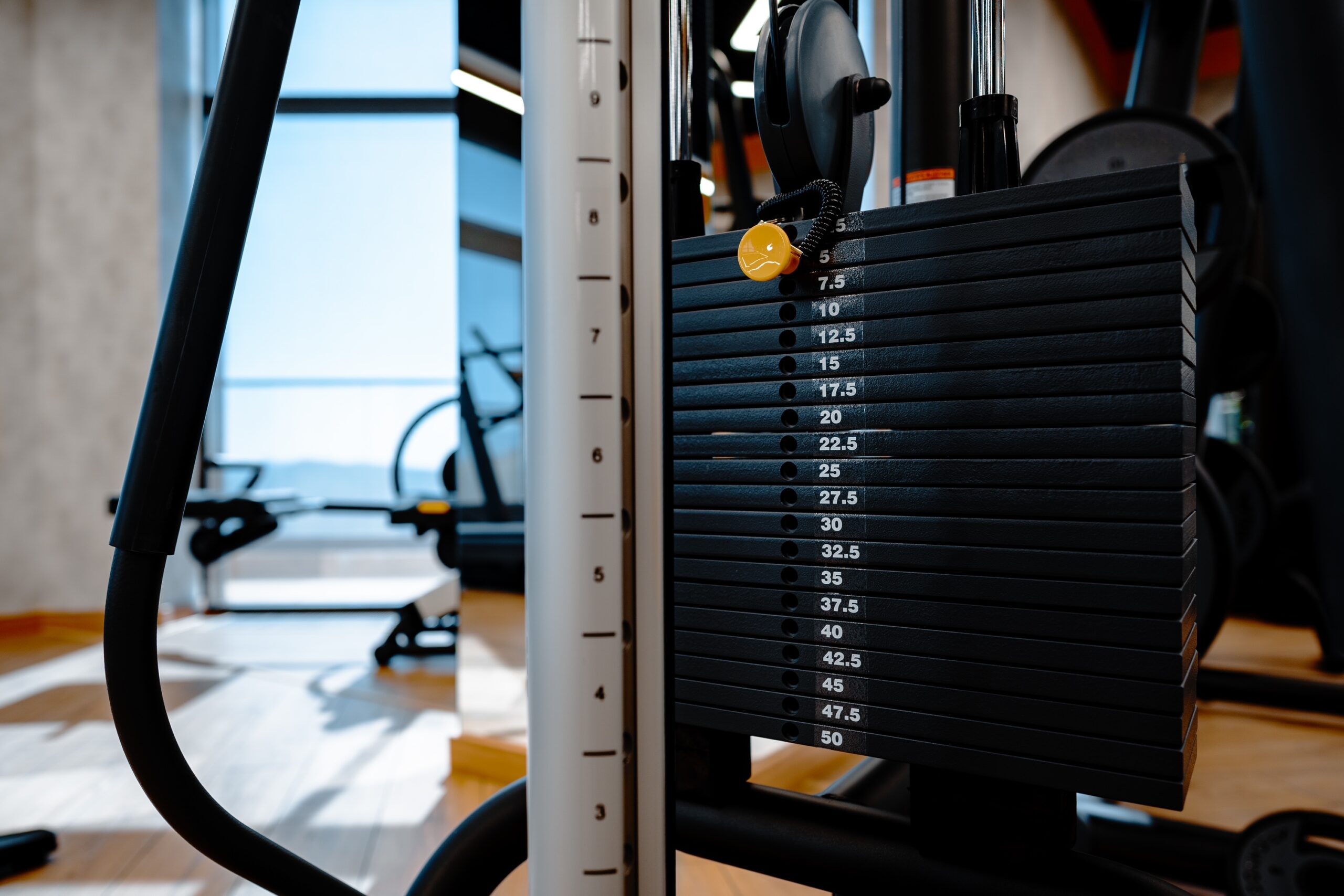 Stacked iron plates of weight machine in gym